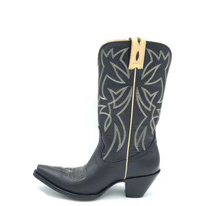 Women's handmade black cowhide leather cowboy boots. Bone vintage style stitch on shaft. Bone pull-straps and side seams. Traditional western toe medallion. Tan lining. 12" height. Snip toe. 2 3/4" high heel. Black leather sole.