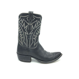 Authentic custom women's cowboy boots from the 1960's. Black cowhide leather with white stitch. Traditional western toe medallion. 10" height. 1 1/2" heel. Pointed toe. Black leather sole. These one-of-a-kind cowboy boots were handmade in Texas. Proudly made in the USA.