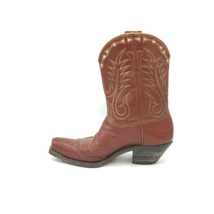 Authentic custom women's cowboy boots from the 1950's. Brown cowhide leather with tan stitch and white diamond shaped inlays on the tops. Inside cloth pull-straps. 10" height. 2" heel. Square toe. Brown sole. These one-of-a-kind Stewart Romero cowboy boots were handmade in Los Angeles, CA. Proudly made in the USA.