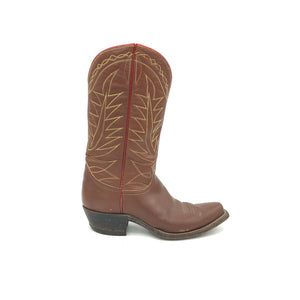 Authentic custom women's cowboy boots from the 1950's. Brown cowhide leather with tan stitch and red piping. Traditional western toe medallion. Inside cloth pull-straps. 12" height. 1 1/2" heel. Snip toe. Brown sole. These one-of-a-kind Tony Lama cowboy boots were handmade in El Paso, Texas. Proudly made in the USA.