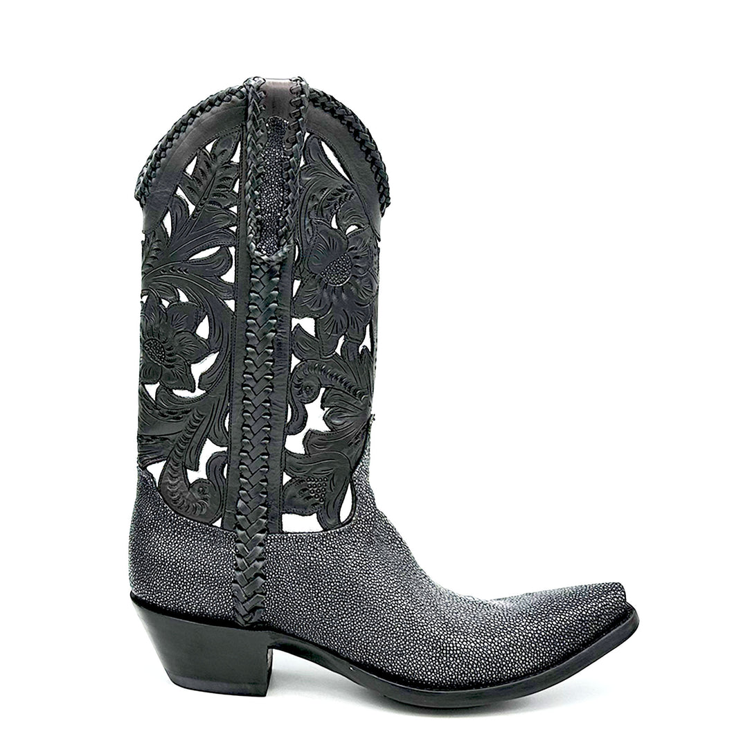 Stingray Western Handtooled in Black is a men's handmade cowboy boot. Shaved black stingray vamp and heel counter. Handtooled black floral overlay on gunmetal cowhide. Black leather braiding on collar, side seams and pull straps. Stingray overlay on pull straps. Black leather lining. 12