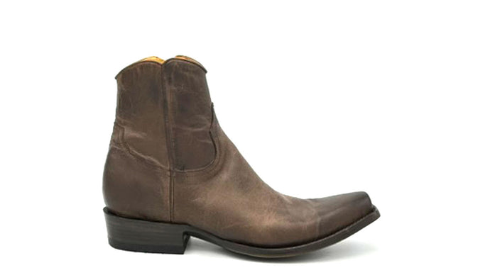 Chase ankle zip in distressed brown is a men's handmade ankle zip cowboy boot. Distressed brown cowhide leather and piping. Inside zip. Tan leather lining. Distressed teak sole finish.