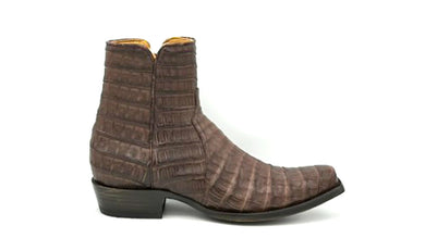 Brown crocodile leather
Inside Zip
Handmade for us by artisans at Old Gringo
7