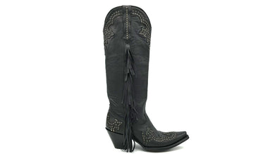 Joplin Fringe is a handmade women's tall cowboy boot. Supple black cowhide leather with brass studded vamp and uppers. Side seams of soft black fringe. Pointed toe and traditional western heel. Black leather lining.