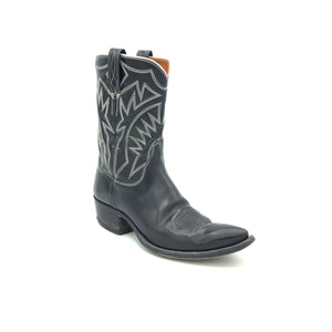 Authentic custom women's cowboy boots from the 1960's. Black cowhide leather with white stitch. Traditional western toe medallion. 10" height. 1 1/2" heel. Pointed toe. Black leather sole. These one-of-a-kind cowboy boots were handmade in Texas. Proudly made in the USA.