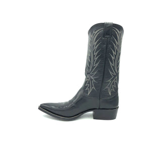 Authentic custom women's cowboy boots from the 1960's. Black cowhide leather with white stitch. Traditional western toe medallion. 12" height. 1 1/2" heel. Pointed toe. Black leather sole. These one-of-a-kind unworn Nocona cowboy boots were handmade in Nocona, Texas. Proudly made in the USA.