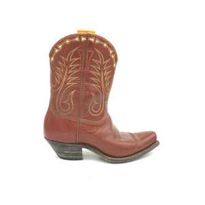 Authentic custom women's cowboy boots from the 1950's. Brown cowhide leather with tan stitch and white diamond shaped inlays on the tops. Inside cloth pull-straps. 10" height. 2" heel. Square toe. Brown sole. These one-of-a-kind Stewart Romero cowboy boots were handmade in Los Angeles, CA. Proudly made in the USA.